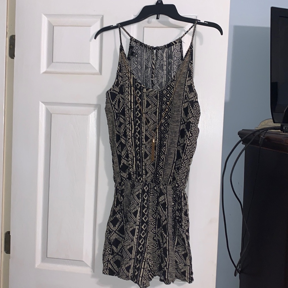 Cute shorts romper with necklace that can be removed.  Barely worn .